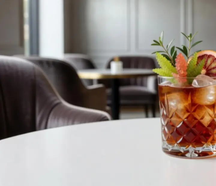 A seasonal signature cocktail garnished with fresh produce